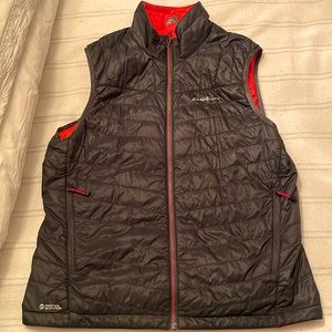 Eddie Bauer black zipper down puffer vest. Orange inside. 3 zippered pockets.